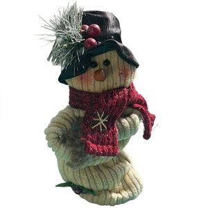 Decorative little snowman in top hat and scarf
